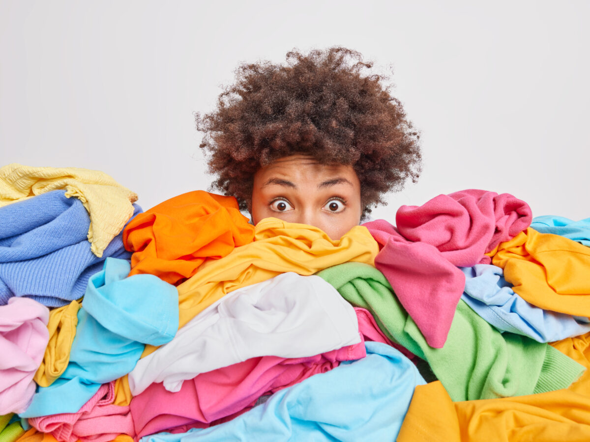 https://appliancechat.com/wp-content/uploads/2022/11/shocked-woman-with-curly-afro-hair-stares-bugged-eyes-drowned-huge-pile-colorful-clothing-cleans-out-closet-selects-clothes-donation-recycling-white-1200x900.jpg